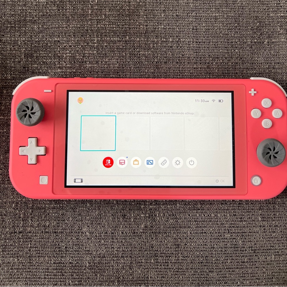 Coral Nintendo Switch, Animal Crossing Game, and case